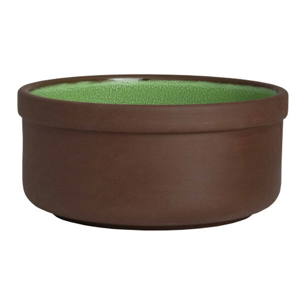 A round brown stoneware bowl with a green interior.