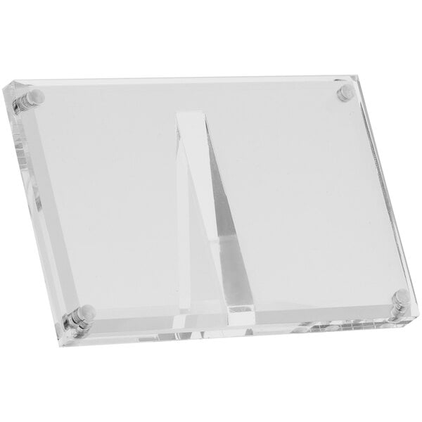 A clear rectangular magnetic card holder made of acrylic.