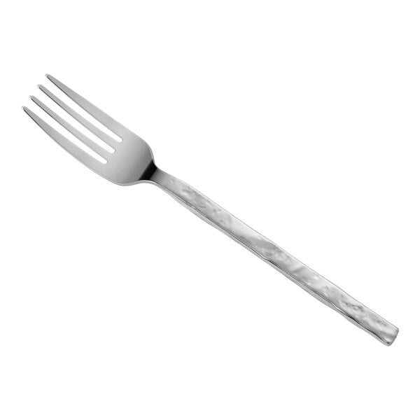 A stainless steel salad fork with a textured handle.