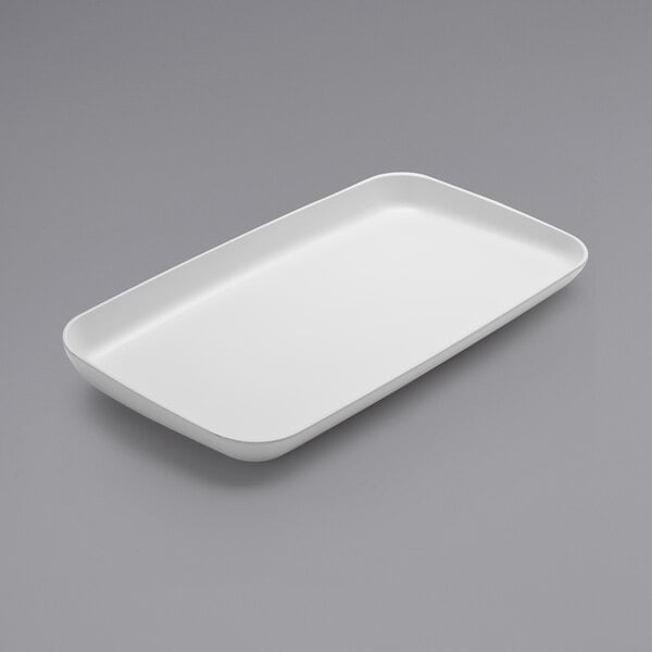 A large, rectangular white melamine platter with slightly raised and slanted edges.