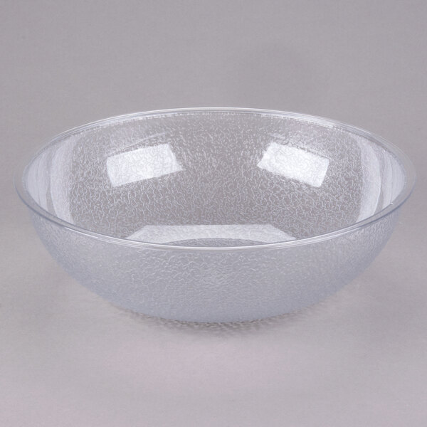 A translucent pebbled polycarbonate serving or salad bowl.