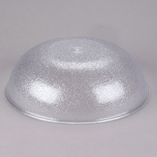 A translucent, pebbled polycarbonate serving or salad bowl.