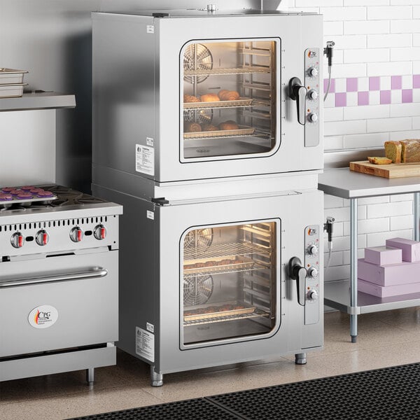 A double-stacked set of half size electric combi ovens with manual controls, designed for commercial kitchen use.