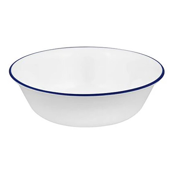 A white round glass cereal bowl with a blue band around the rim.