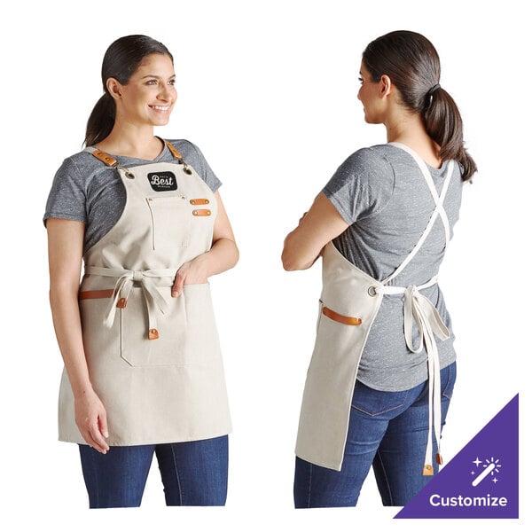 A cream-colored, heavy weight canvas cross-back bib apron with three pockets, shown from the front and back on a person.