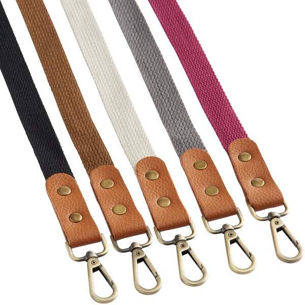 A set of five cross-back replacement straps in various colors with leather and metal clip attachments.