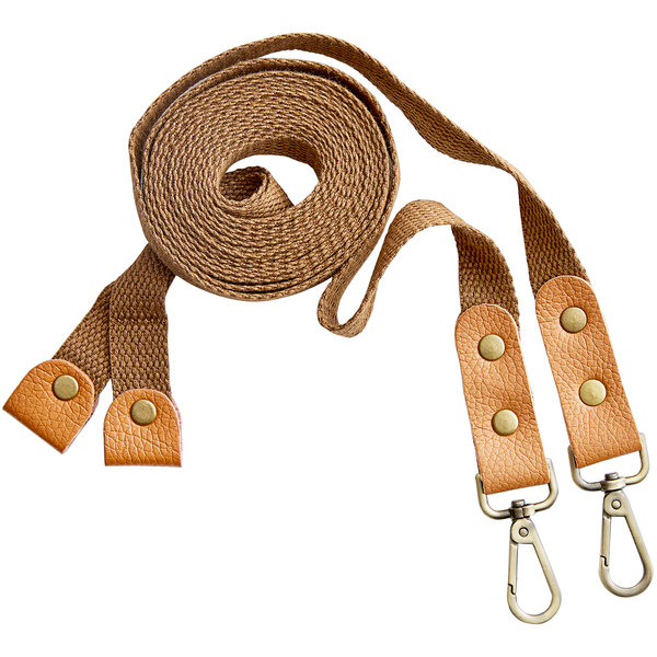 A pair of brown cross-back replacement straps with leather accents and metal clips.