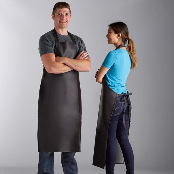 A heavy weight brown vinyl dishwasher apron measuring 40 by 25 inches.