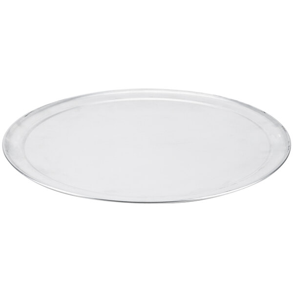 An American Metalcraft clear round plate with a silver rim.