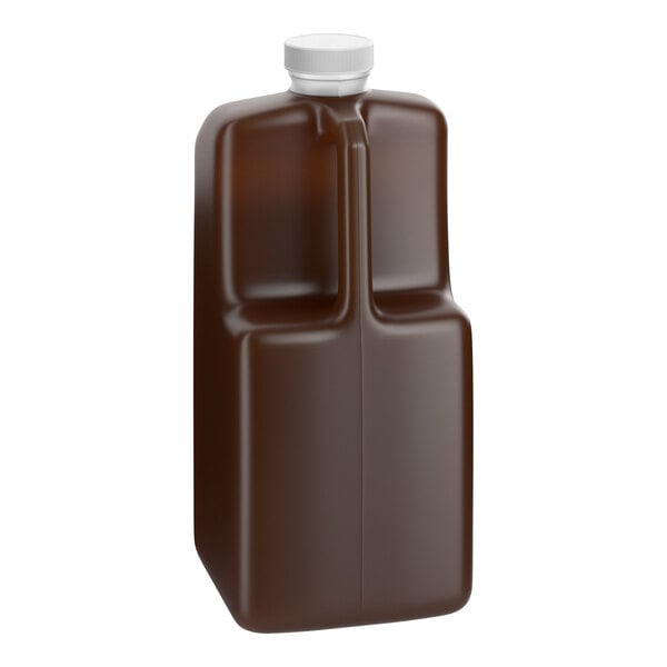 A 64 fl. oz. bottle of Capora Pumpkin Pie Flavoring Sauce with a white cap.