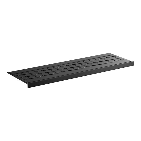 A black rubber stair tread mat with a coin-top surface pattern.