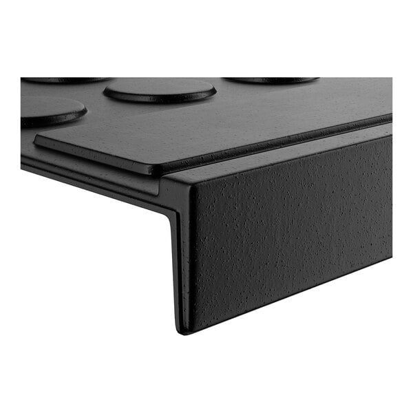 A black coin-top rubber stair tread mat with a textured surface and a right-angle edge.