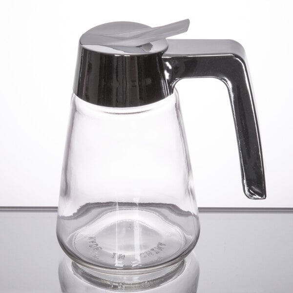 A glass syrup dispenser with a chrome-plated ABS top and handle.