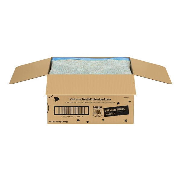 A large open cardboard box containing Nestle Toll House Premier White morsels.