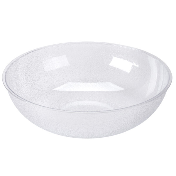 A large translucent pebbled polycarbonate serving or salad bowl.