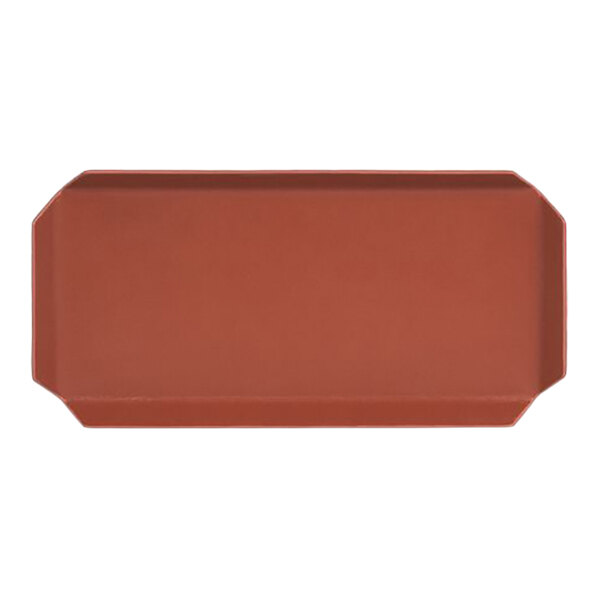 A rectangular faux leather amenity tray in a canyon orange color.