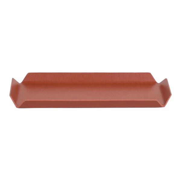 A rectangular faux leather amenity tray in a canyon orange color.