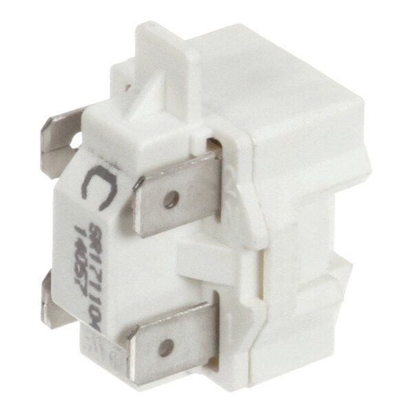 A white electrical relay with metal terminals, used in True Refrigeration units.