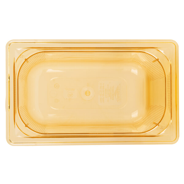 A yellow plastic Vollrath Super Pan with a lid.