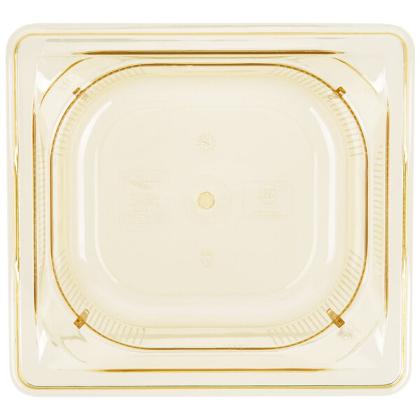 A clear plastic container with a yellow circle and a lid.