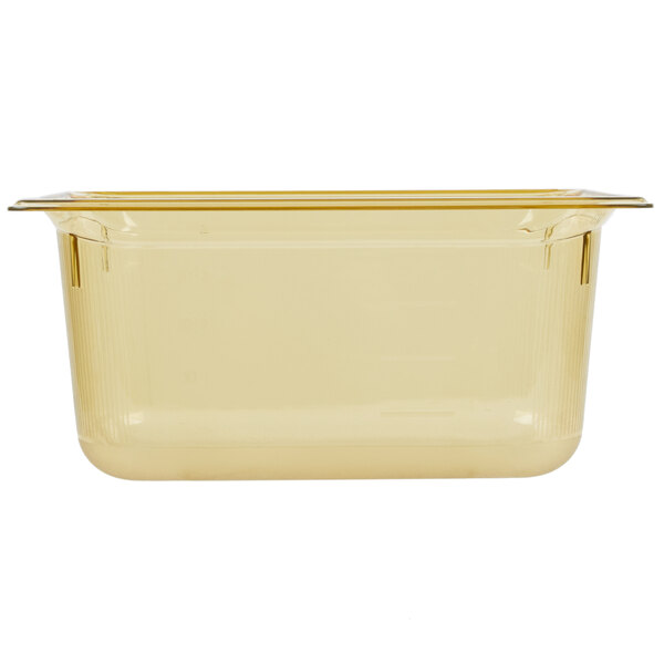 A Vollrath 1/3 size amber plastic food pan with a lid.
