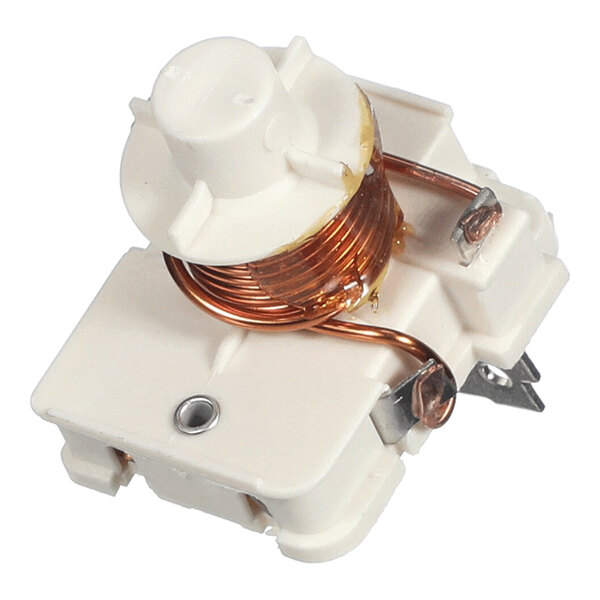 A white electrical relay component with copper wire coils and metal connectors.