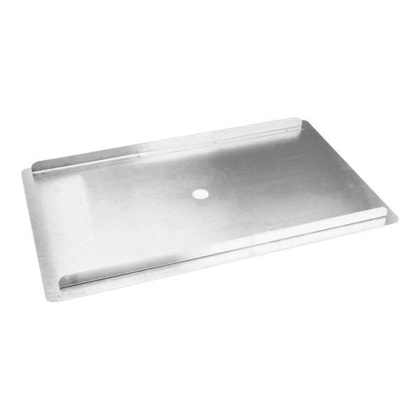 A rectangular metal cover with a central hole and raised edges.