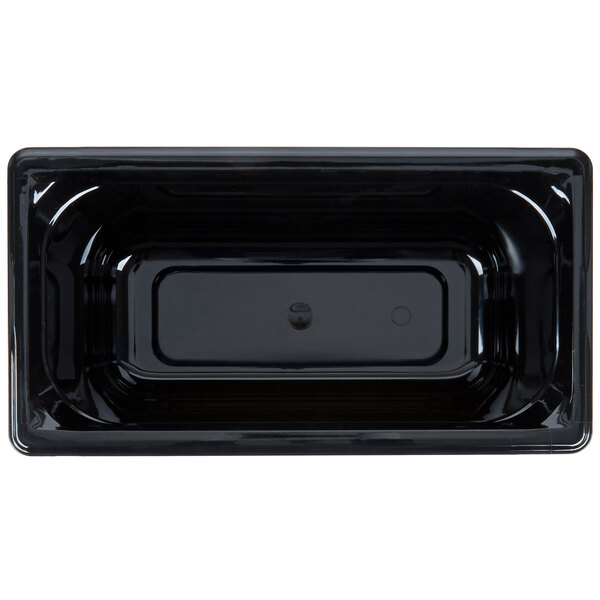 A black plastic container with a hole in the middle.