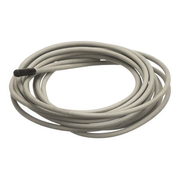 A coiled sensor cable with a black probe at one end.
