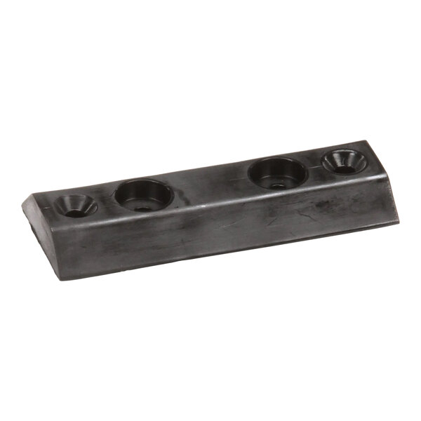 A black rectangular rubber contact pad housing with three recessed holes.