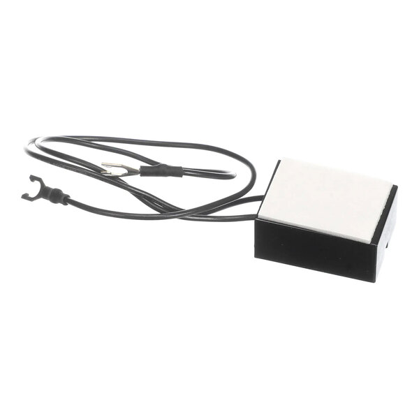 A rectangular electronic component with attached black wires, identified as a BKI R0140 RC element for R0127.