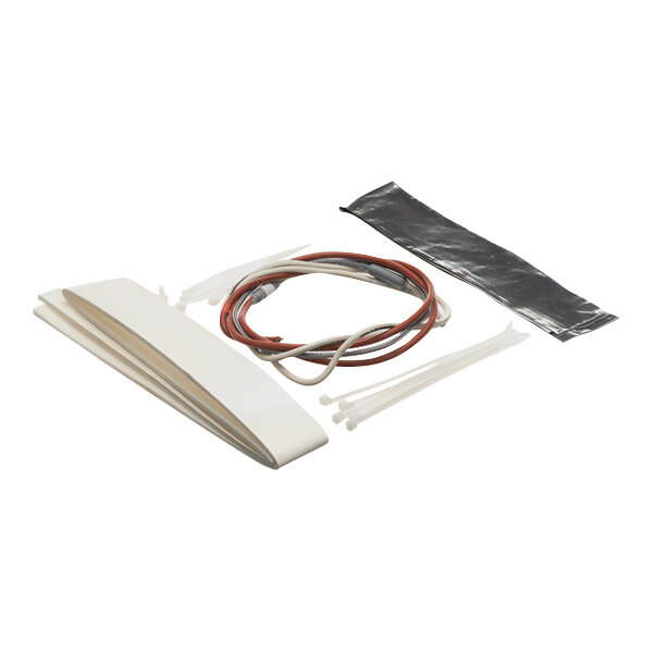 A kit for TXV heater installation including wires, zip ties, insulation, and a strip of adhesive material.
