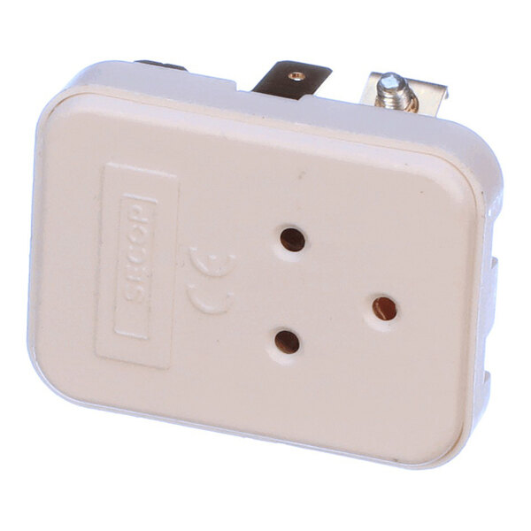 A beige electrical relay component with three circular holes and metal prongs, used in refrigeration systems.