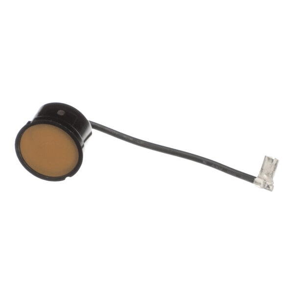 An electrical overload protector with a black casing, a single wire, and a connector, used in refrigeration equipment.