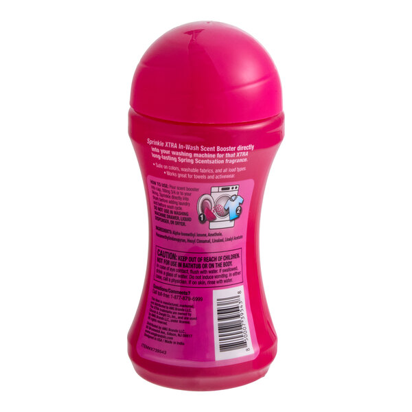 A pink bottle of XTRA Spring Scentsation laundry scent booster.