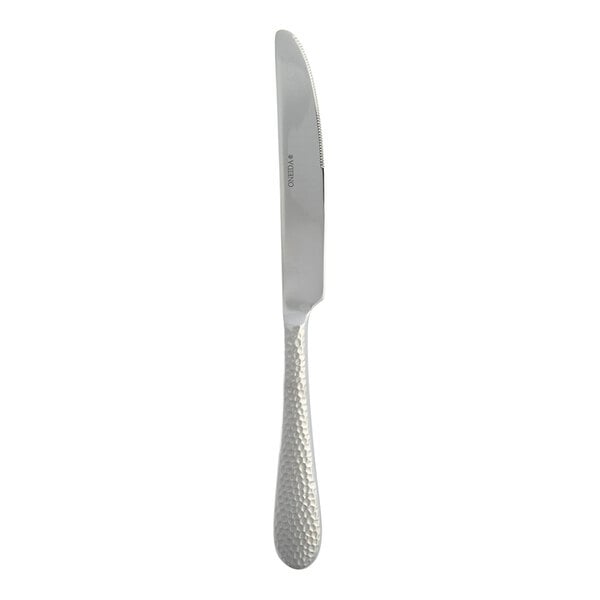 A stainless steel dessert knife with a textured handle.