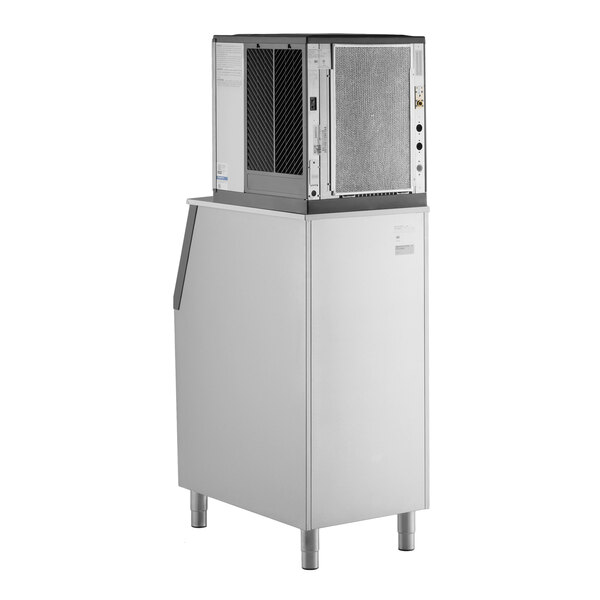 An air-cooled modular half cube ice machine with a large storage bin.