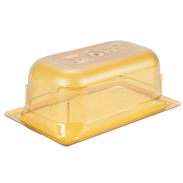 A Vollrath amber plastic food pan with lid.