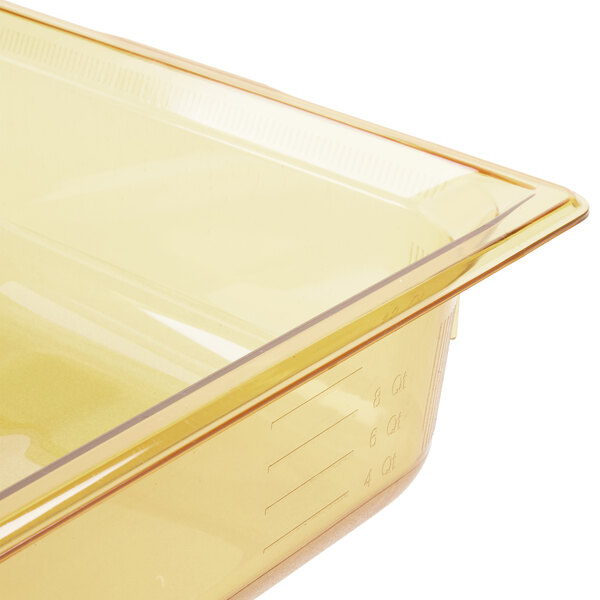 A Vollrath amber plastic food pan with a lid.