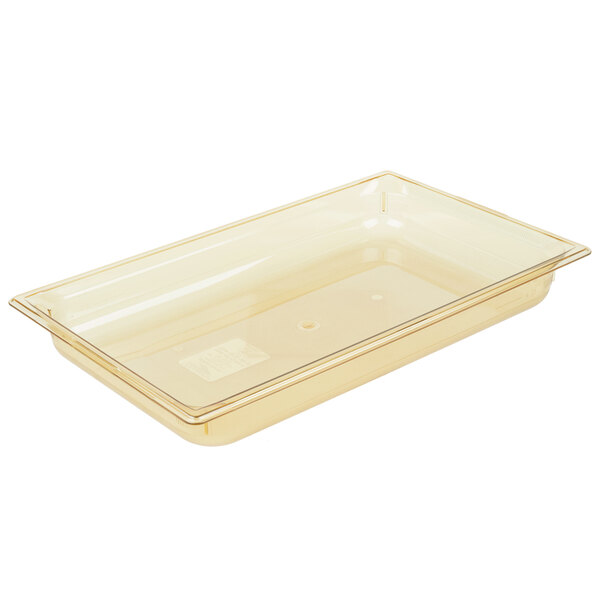 A Vollrath amber plastic food pan with a lid.