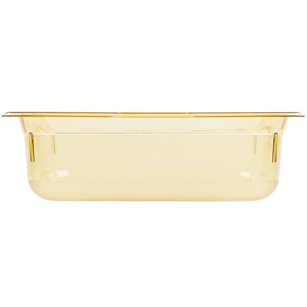 A clear plastic Vollrath Super Pan with a gold lid.