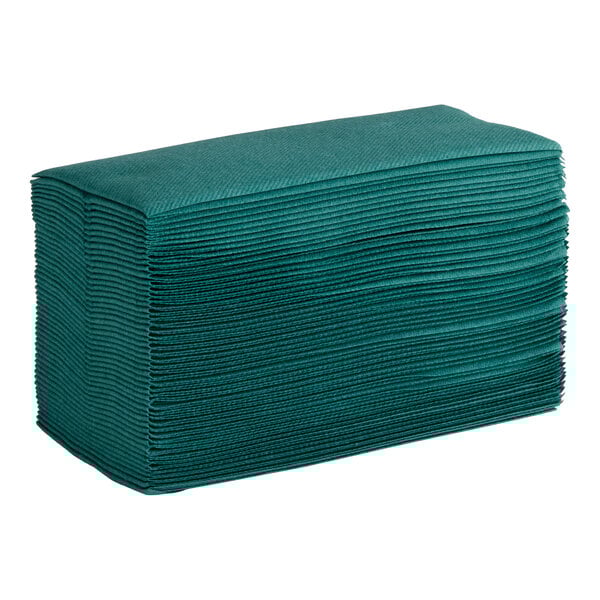 A stack of hunter green airlaid linen-feel guest towels folded in a 1/6 style.