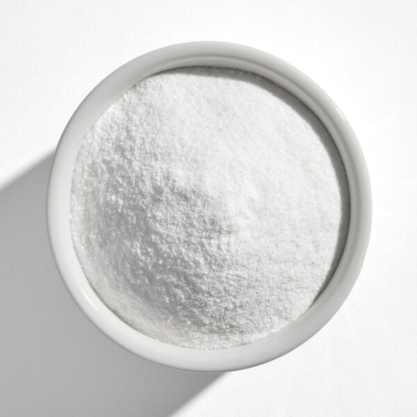 A white bowl filled with a fine white powder, identified as Dutch-Jell natural pectin mix.
