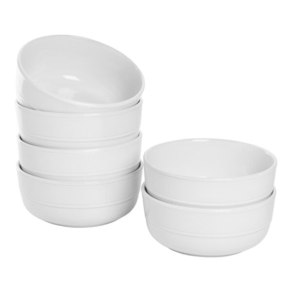 A set of six round white stoneware cereal bowls with a double line design.