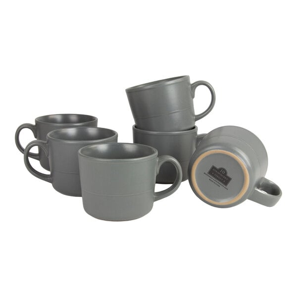 A set of six matte dark gray stoneware mugs, each with a 12 oz. capacity.