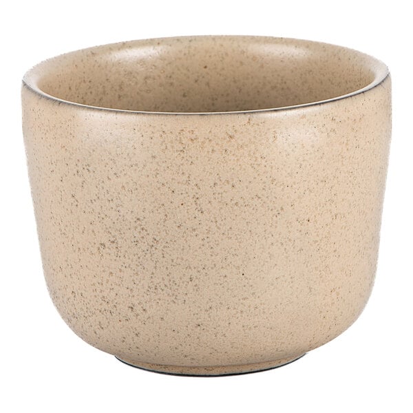 A round tan stoneware sake cup with an 8 oz. capacity.