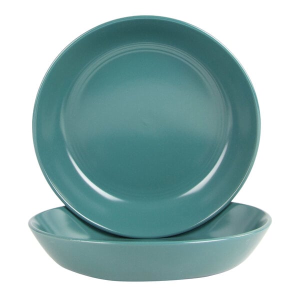 A set of two round emerald green stoneware dinner bowls.