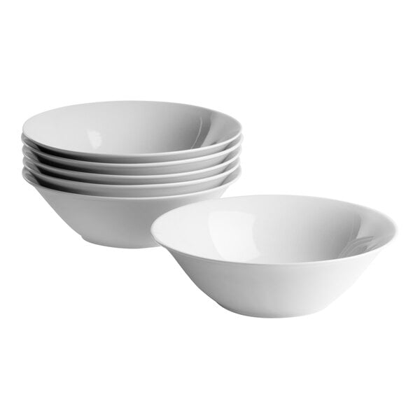 A set of six round white porcelain cereal bowls, each with a 20 oz. capacity.