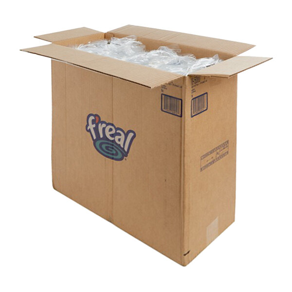 A large cardboard box labeled 'f'real' containing flat plastic lids with straw slots.