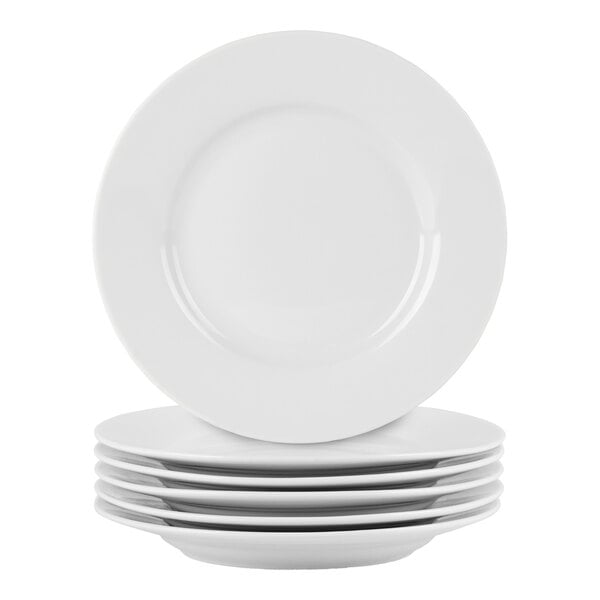 A set of six round white porcelain appetizer plates with wide rims.